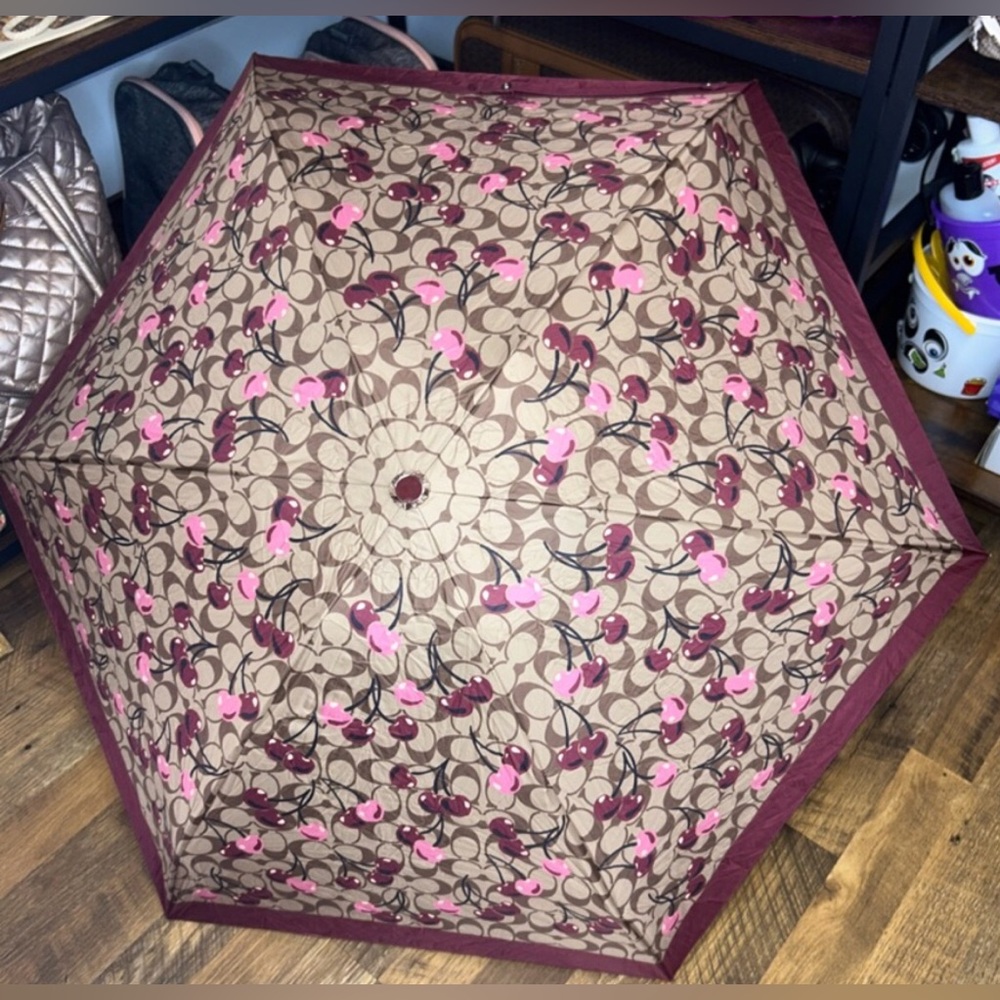 Coach Cherry Print Umbrella in Pink, Burgundy, gold, and Brown